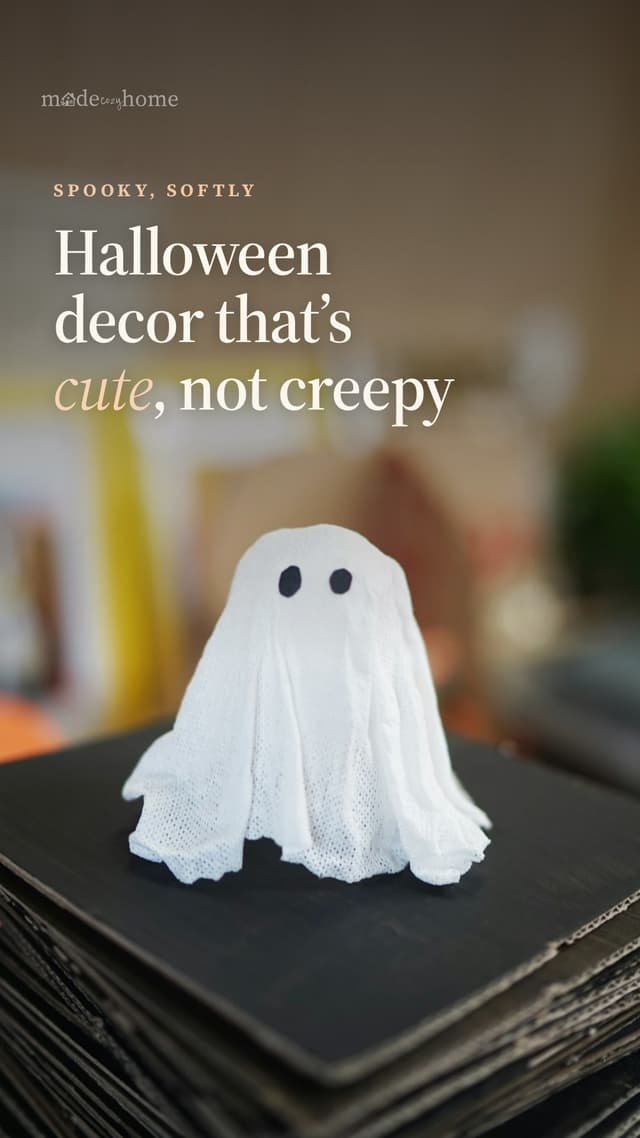 A small ghost decoration on a stack of b