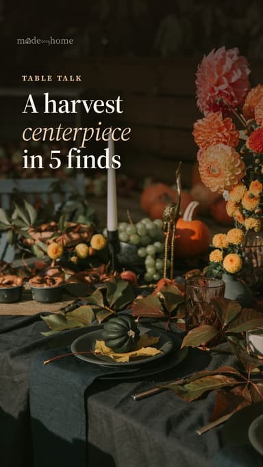 A table set for autumn with dahlias, pum