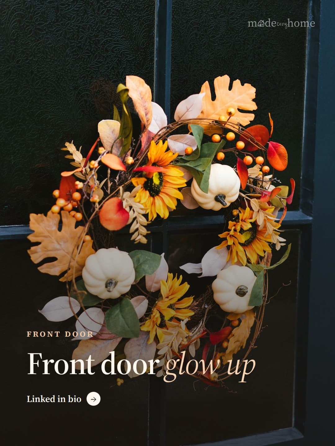 A wreath is hanging on a window sill