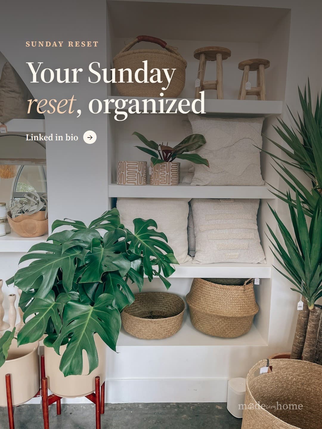 a white shelf filled with lots of basket