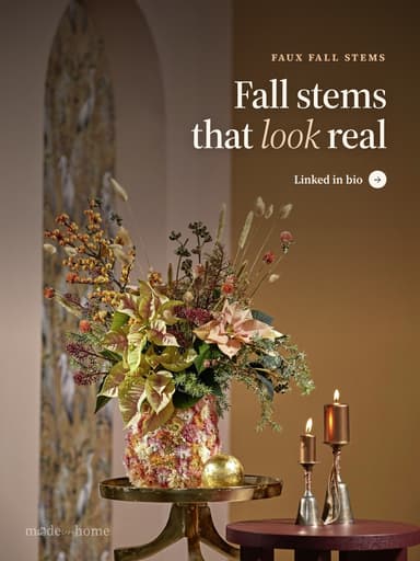 A floral arrangement with candles and de