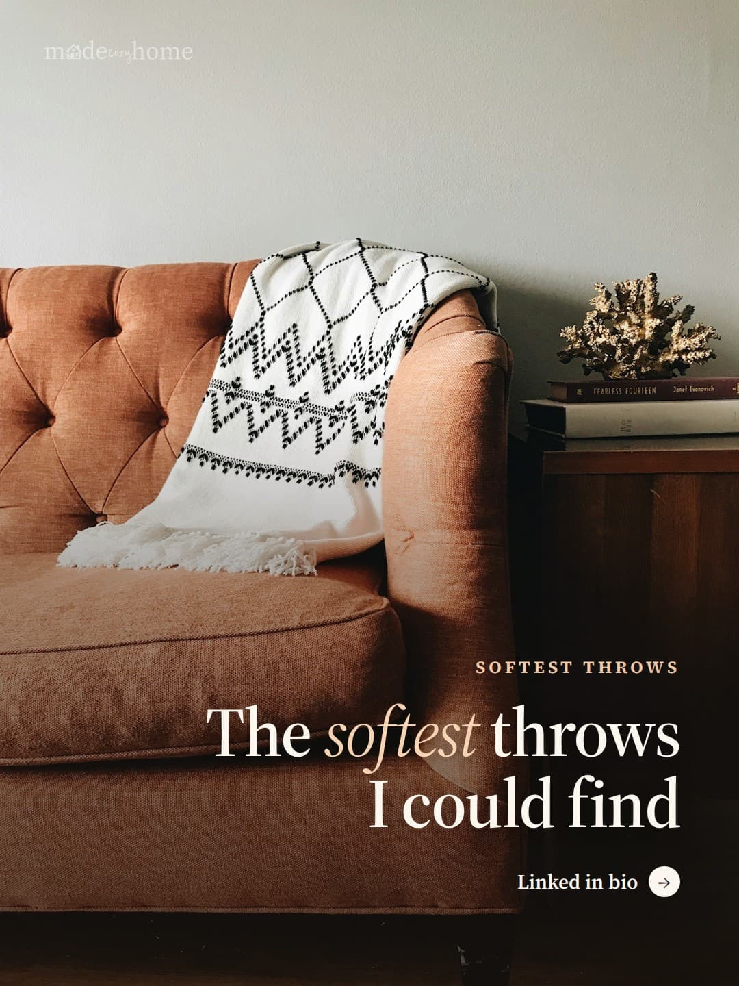 white and black textile on brown couch