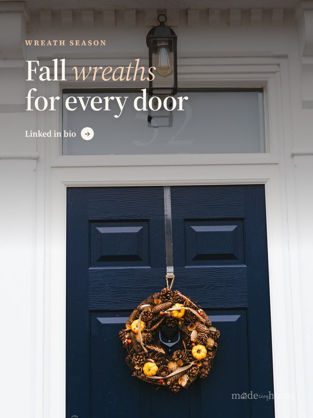 A blue door with a wreath hanging on it