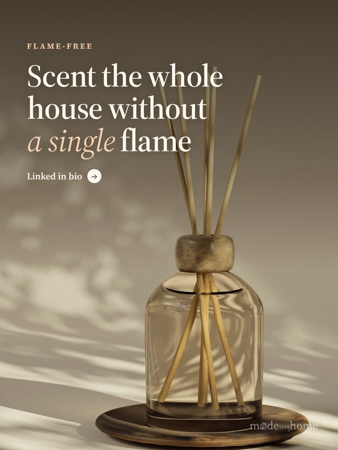A reed diffuser sits on a wooden plate