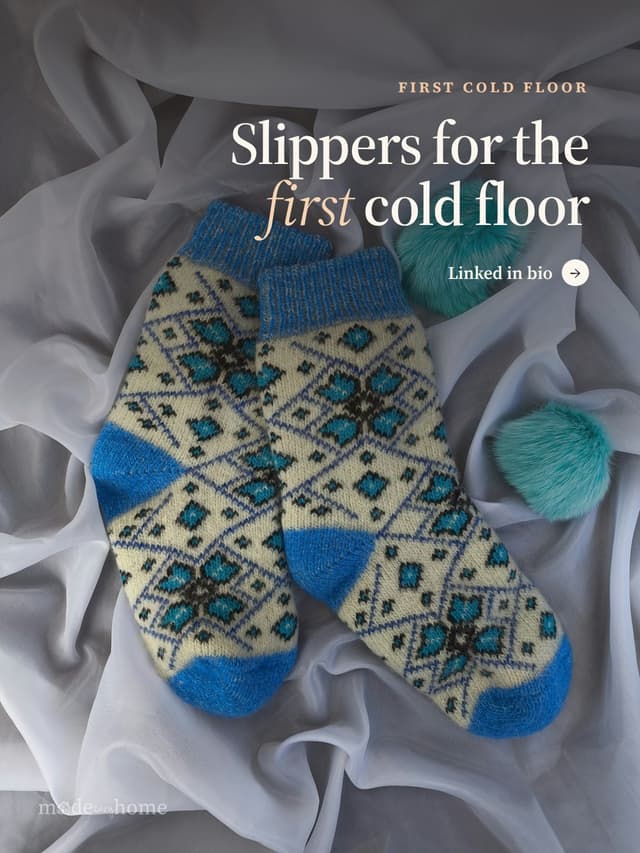 A pair of socks laying on top of a white