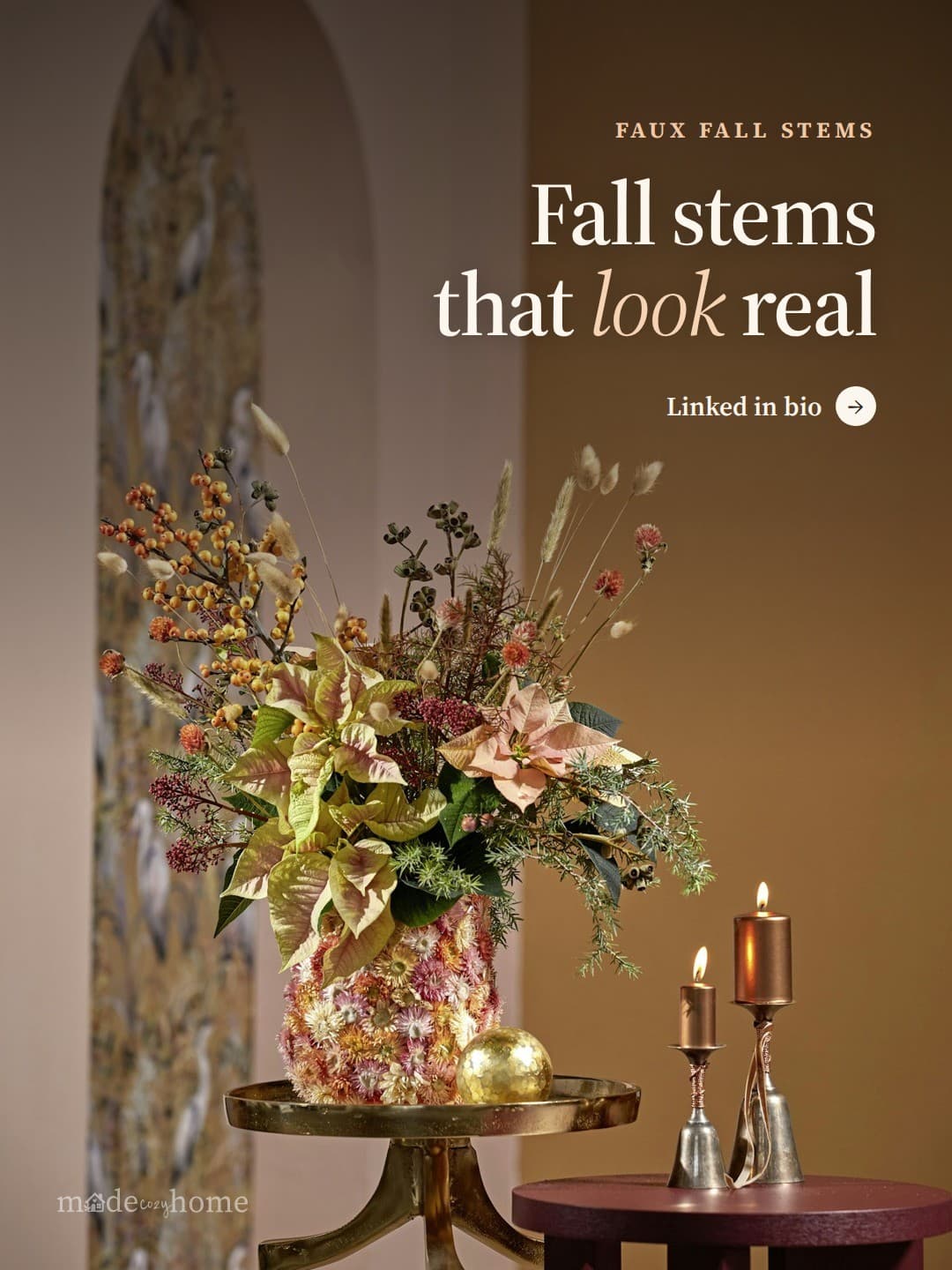 A floral arrangement with candles and de