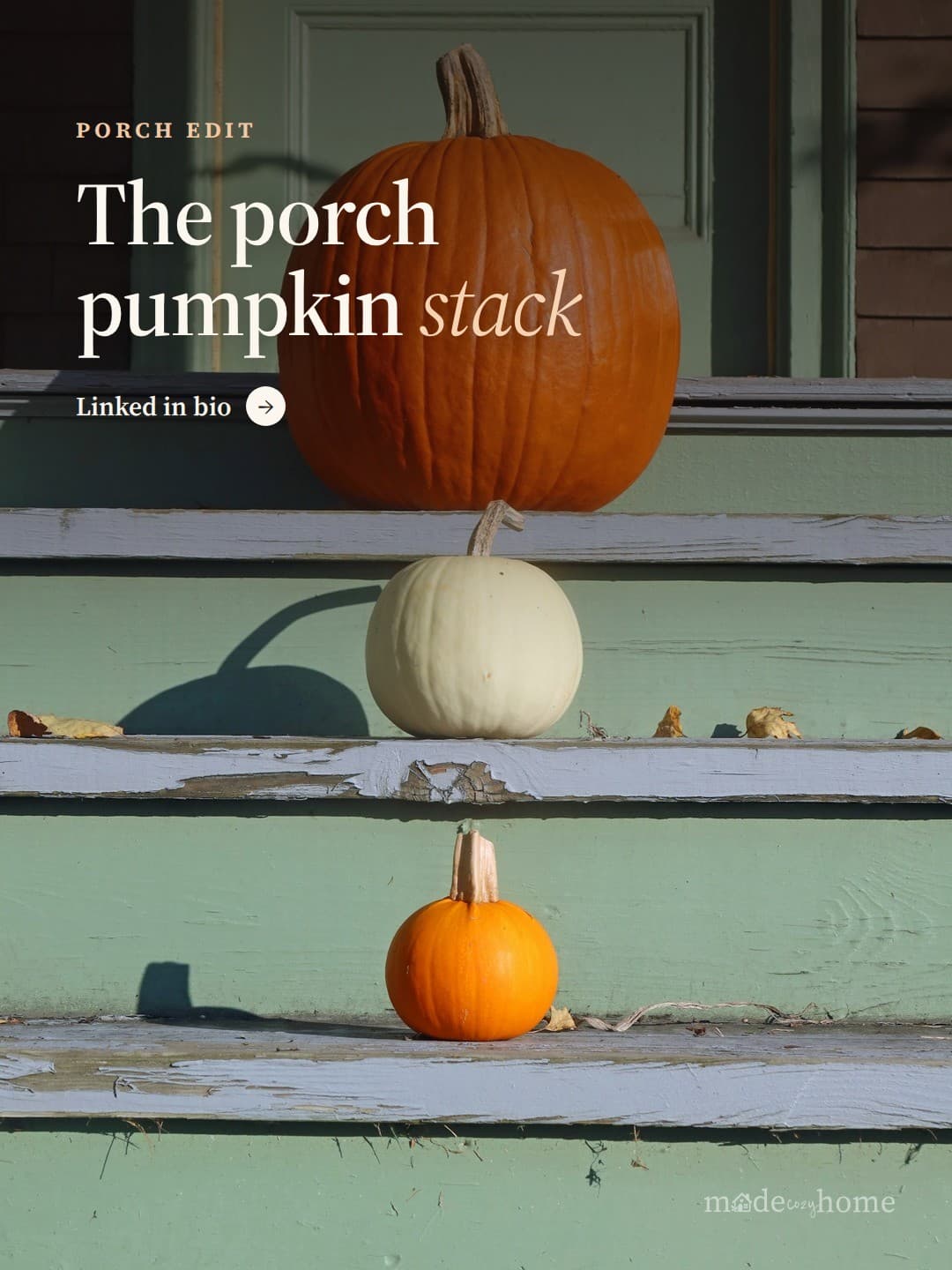 two pumpkins sitting on the steps of a h