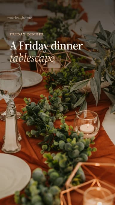 a long table is set with candles and pla