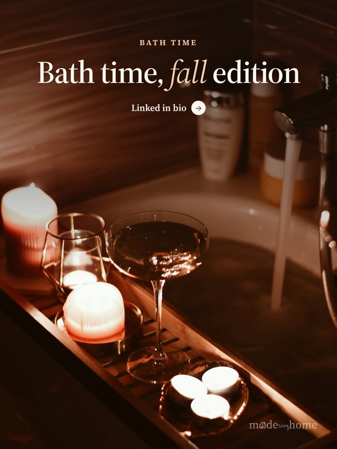 A bath tub filled with candles and a win
